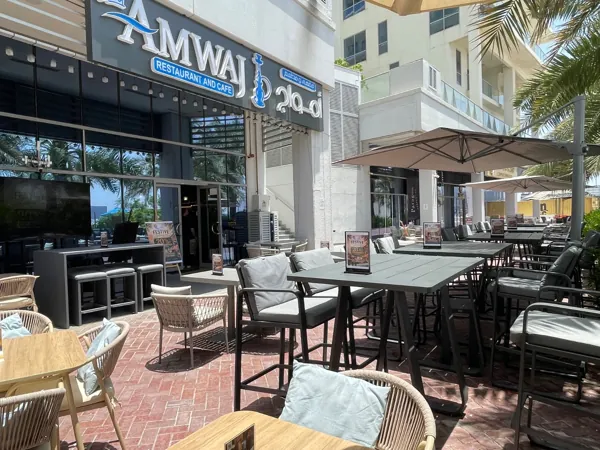 Among the palms · The Amwaj terrace